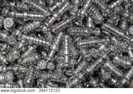 Blurred. Dubel Screwed Under A Screed For Assembling Furniture For The House And Office