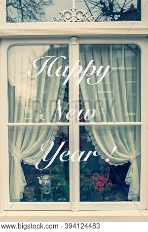 White Window Of Ahouse With Happy New Year Greeting Text. Family And Cozy Life Concept.