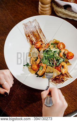 Fresh Salad Plate With Shrimp, Tomato And Mixed Greens On Wooden Background Close Up. Healthy Food.h
