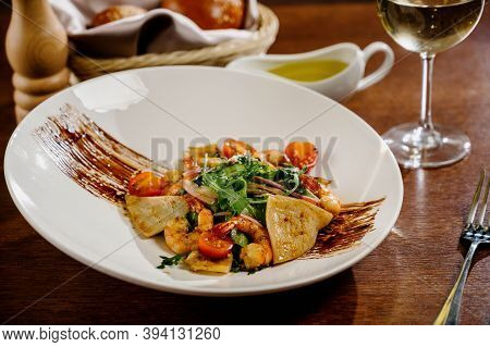 Fresh Salad Plate With Shrimp, Tomato And Mixed Greens On Wooden Background Close Up. Healthy Food.h