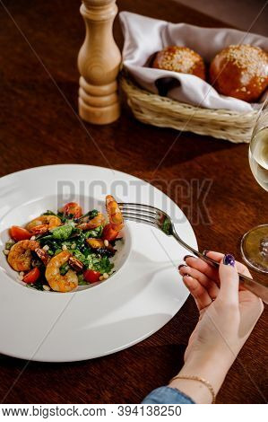 Fresh Salad Plate With Shrimp, Tomato And Mixed Greens On Wooden Background Close Up. Healthy Food.h