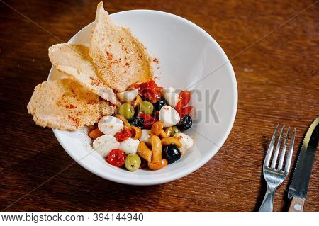 Appetizer With Pickled Mushrooms, Olives, Parmesan On Wooden Background
