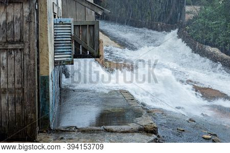 Scene Showing Flooding On A Street With Buildings
