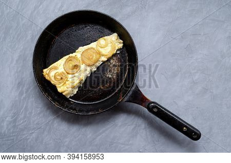 Fried Baked Mackerel Trachurus With Onions And Dried Herbs In An Old Frying Pan. Country Style. Top 