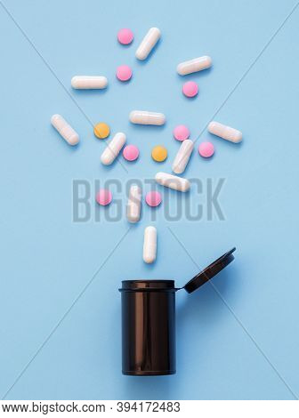 Opioid Epidemic, Painkillers And Drug Abuse Concept With Close Up On A Bottle Of Prescription Drugs 