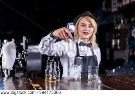 Charming Girl Bartender Makes A Show Creating A Cocktail Behind Bar