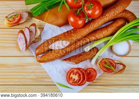 Tomatoes, Bread And Kielbasa With Chives On Wooden Background. Close Up.