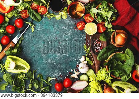 Fresh Helthy Food Cooking Vegetable Ingredients On Dark Background With Rustic Wooden Board. Diet Or