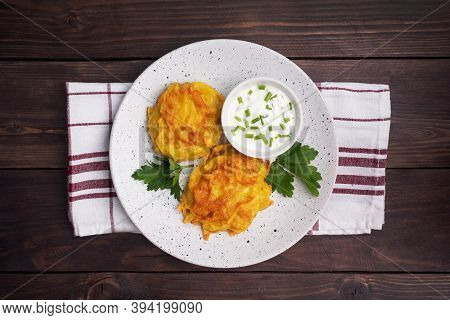 Fried Cakes Of Grated Potatoes On The Plate With Sauce. Traditional Pancakes Boxty Raggmunk.