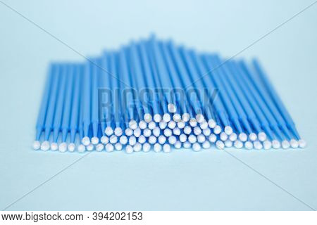 Blue Microbrushes, Small Brushes For Cleaning Eyelashes And Teeth. Blue Background. Dentistry, Eyela