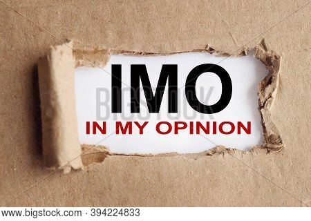 Imo. In My Opinion, Text On White Paper On Torn Paper Background