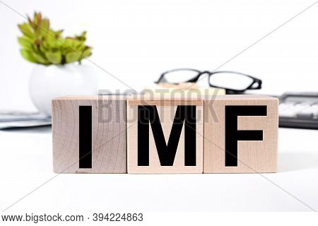 Imf, Text On Wood Cubes On A Light Background