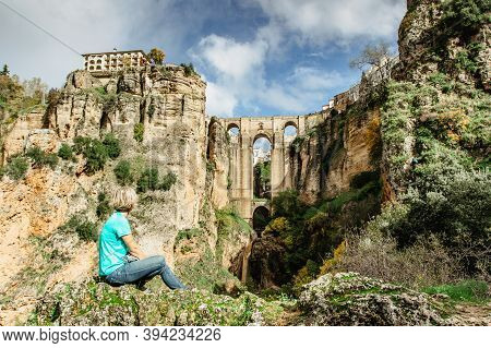 Woman Traveler Enjoying A Gorgeous View Of Ronda,spain.the Puente Nuevo New Bridge Over Guadalevin R
