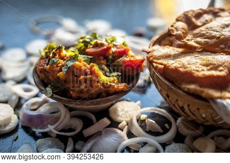 Close Up Shot Of Batate Ki Sukhi Bhaji Or Potato Sabji In A Clay Bowl Along With Some Dry Plain Frie