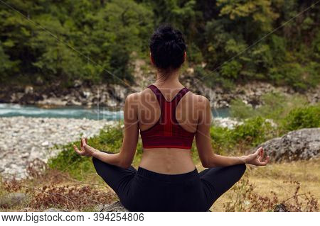 Yoga Classes In Nature. The Concept Of Playing Sports Alone. Social Exclusion. A Woman Does Yoga On 