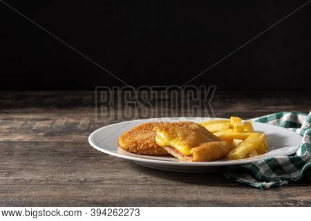 San Jacobo Steak Filled With Cheese And Ham On Wooden Table.copy Space