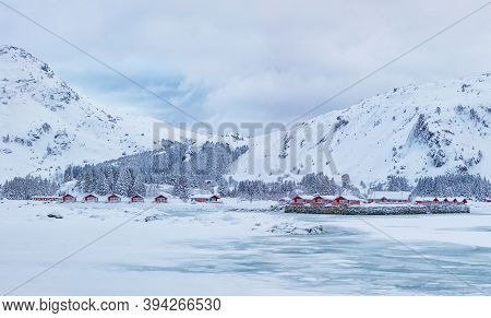 Winter Scene With Traditional Norwegian Red Wooden Houses On The Shore Of Rolvsfjord In Valberg On V