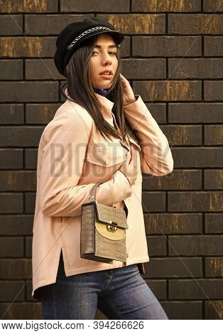 Beautiful Stylish Woman Walking In Pink Jacket. Wearing Trendy Hat Headwear. Street Style. Spring Fa