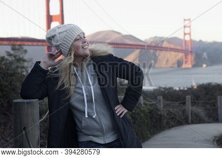 View Of A Young Girl In Black Coat Near Golden Gate In San Francisco