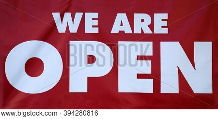 WE ARE OPEN. Red WE ARE OPEN vinyl sign. Open for business sign. 