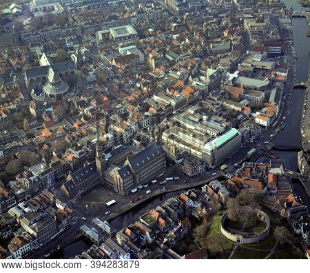Leiden, Holland, December 3 - 1984: Historical aerial photo of the center of Leiden, Holland with the river Rhine, Burcht, Town hall and Pieters church