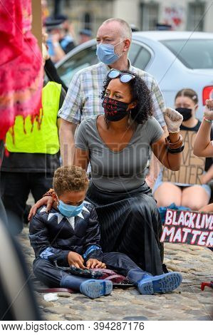 Richmond, North Yorkshire, Uk - June 14, 2020: Powerful Bame Woman Wears Black Lives Matter Ppe Face