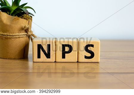 Wood Cubes With Acronym 'nps' - 'net Promoter Score' On A Beautiful Wooden Table, White Background. 