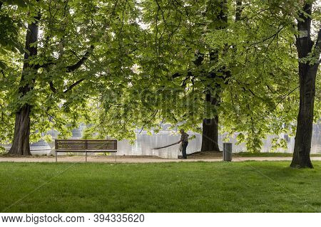 Prague, Czech Republic - May 22, 2020: Strelecky Ostrov Island, With An Old Man Cleaning The Paths U