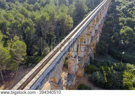 View Of The Roman Aqueduct Pont Del Diable, Tarragona, Spain. Detail Upper Part Of The Water Channel