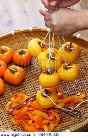 How to make Japanese dried persimmons ( Hoshigaki ); Preparing to hang  persimmon fruits.