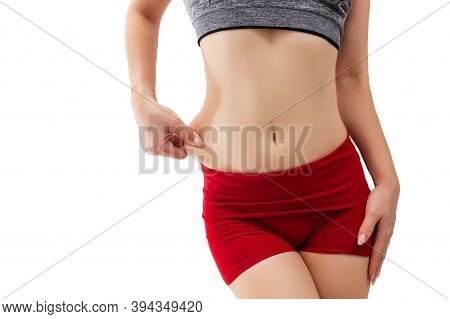 She Pulls The Hand Skin Showing Fat In The Abdomen And Flanks. Treatment And Disposal Of Excess Weig