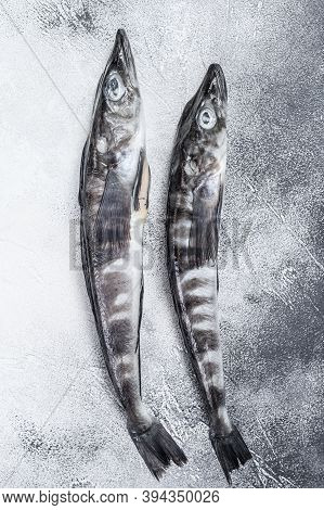Raw Icefish On A Kitchen Table. White Background. Top View