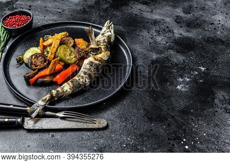 Baked Whole Icefish With Grilled Vegetables. Black Background. Top View. Copy Space