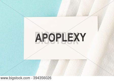 Word Apoplexy With Medical Mask On A Blue Background.