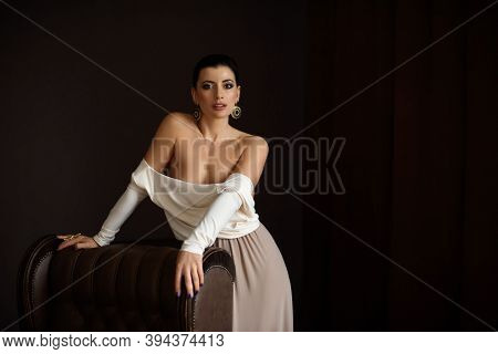 Sexy Beautiful Woman Half Naked Standing By A Couch