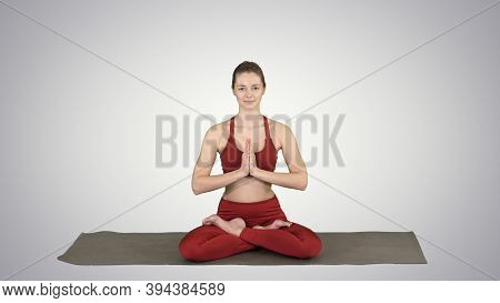 Beautiful Young Woman Sitting In Yoga Pose Lotus Changing Positi