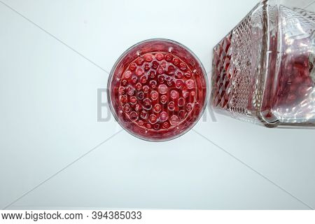 Top View Glass Home Made Tincture With Red Berry. Homemade Tincture Of Red Cherry. Berry Alcoholic D