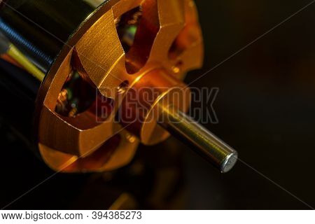 Brushless Motor (bldc) Outrunner For Aircraft Model Close-up On A Black Background. Selective Focus.