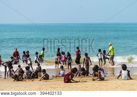 Candolim, Goa, India - February 14, 2019: Indian Group Of Children On The Shore Of The Arabian Sea S