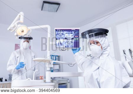 Patient Pov Listening Explication For Teeth Treatment Showing X-ray On Monitor. Stomatology Speciali