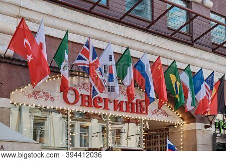 Moscow \ Russia 06 10 2019: Flags Of Different Countries Of The World Over The Onegin Restaurant On 