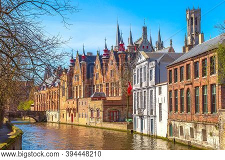 Bruges, Belgium Historic Medieval Brick Houses With Towers Street View Along Groene Rei Canal