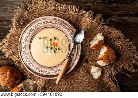Delicious Cream Soup, Pea Sprouts In Bowl With Bread On Table. Diet Fresh Food Meal Dish Soup Lunch 