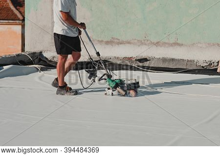 Worker Welding Pvc Roof Membrane By Heater With Welder Machine