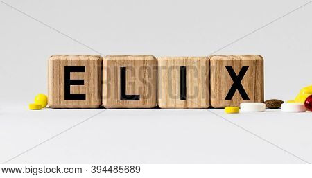 Cubes With The Word Elix On Them. Care Concept.