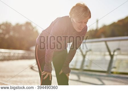 Dont Overdo It. Active Mature Woman In Sportswear Looking Tired And Exhausted, Taking A Rest After R