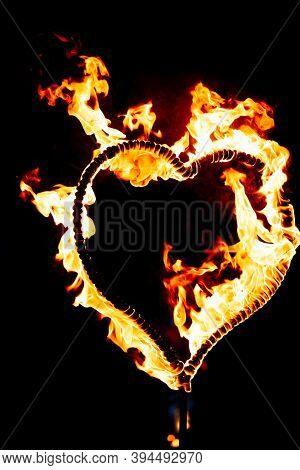 Burning Heart With Flames. Isolated On Dark Background. Fire Show In Night. Happy Valentines Day Car