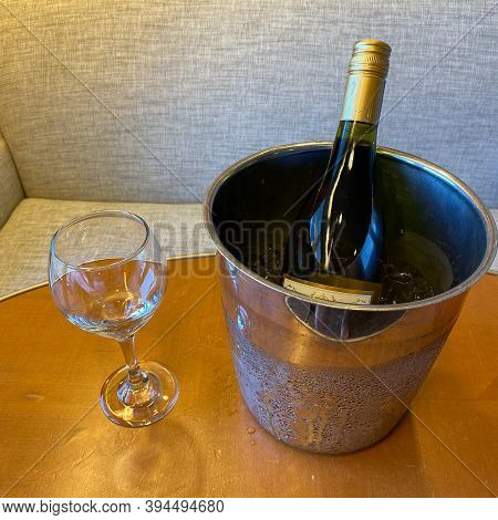Wine Glass And Bucket Of Ice Down Wine.