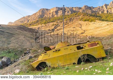 Side Of An Abandoned War Tank With Vegetation Growing Inside Close To Shushi In The Republic Of Arst
