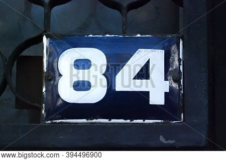 Weathered Grunge Square Metal Enameled Plate Of Number Of Street Address With Number 84
